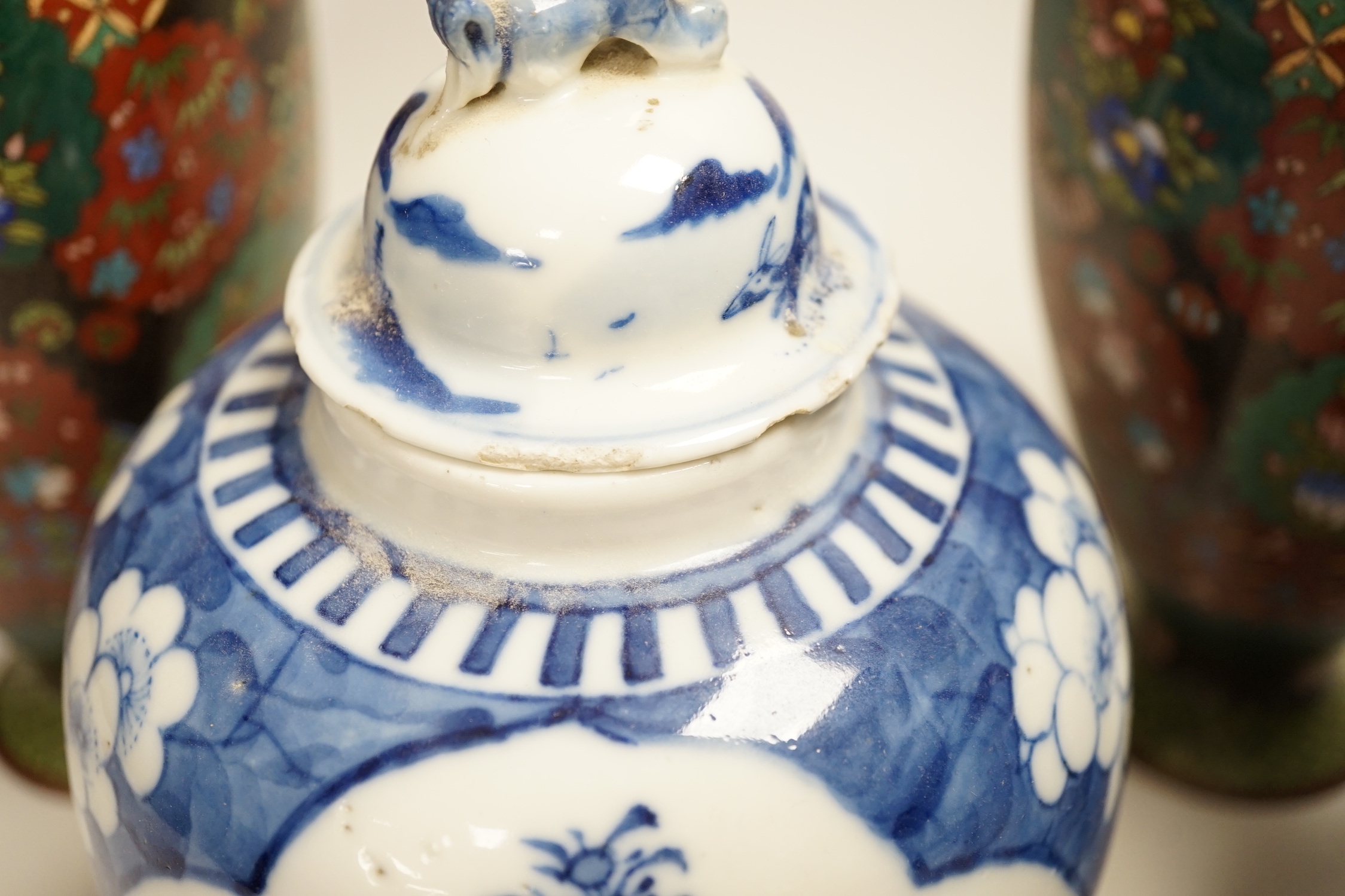 A pair of Chinese blue and white jars and associated covers and a pair of Japanese cloisonné enamel vases, cloisonné vases 21cm high